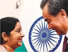  ?? AFP ?? Sushma Swaraj (left) meets Wang Yi (right) at the Diaoyutai State Guest House in Beijing, China, yesterday.