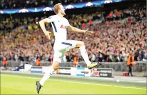  ?? ADRIAN DENNIS/AFP ?? Tottenham Hotspur’s Harry Kane celebrates after scoring Spurs’ third and his second in the Champions League match against Dortmund on September 13.