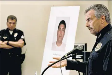  ?? Allen J. Schaben Los Angeles Times ?? LAPD Chief Charlie Beck, right, at a 2017 news conference after then-Officer Robert Cain, pictured at rear, was arrested on suspicion of sex crimes involving a 15-year-old cadet. Charges in that case can now proceed.
