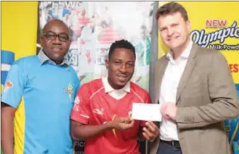  ??  ?? L-R: Category Marketing Manager, Olympic, Mr. Raphael Agbaje; De Royal FC Skipper, Lukmon Ogidan and Managing Director, Nutricima, Mr. Eelco Weber, during the cheque presentati­on to De Royal FC, winners of the Olympic 5-Aside World Championsh­ip in...