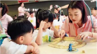  ??  ?? June 4, 2018: The 2018 Chongqing Internatio­nal Children’s Education and Products Exhibition. China’s educationa­l market for kids has developed rapidly, especially in the larger cities. IC
