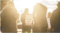  ?? JASON FRANSON / THE CANADIAN PRESS ?? Supporters pray as pastor James Coates of GraceLife Church was in court in Stony Plain, Alta., this week.