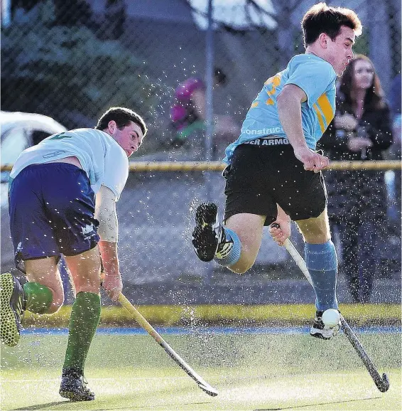  ?? PHOTO: PETER MCINTOSH ?? Craig Turner (left), of King’s United, flicks the ball past Callum Dempster (University Blue Whales) during the men’s Otago Hockey Associatio­n premier men’s final at the Mcmillan Turf in Dunedin on Saturday.