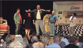  ??  ?? Catoosa County Sheriff Gary Sisk (center stage) shows off his cool as “Fonzie” during the “Happy Days, Again” Mystery Dinner Show Saturday, March 24. (Catoosa News photo/Adam Cook)