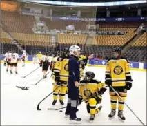  ?? COURTESY, ANTHONY MACCARI ?? Waterloo Wolves’ Dominic Hemphill, Ethan Hunter and Ivan Urquhart hit the ice at Air Canada Centre.