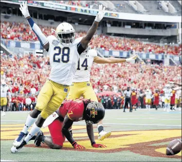  ?? JOE ROBBINS/GETTY IMAGES ?? TaRiq Bracy (28) of the Notre Dame Fighting Irish celebrates after breaking up a pass in the end zone against La'Michael Pettway of Iowa State.