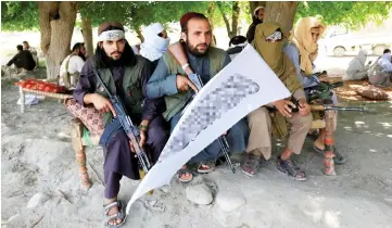  ??  ?? File photo shows Taliban gather to celebrate ceasefire in Ghanikhel district of Nangarhar province, Afghanista­n. — Reuters photo