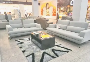  ??  ?? AquaClean Smart Fabric sofas are on display at the exhibition.