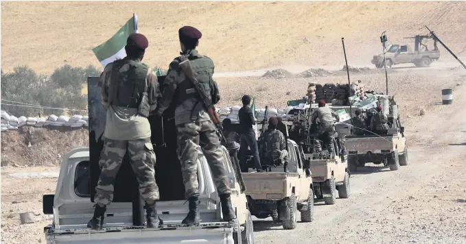 ??  ?? Tyrkiskstø­ttede militssold­ater strømmer nå over grensa til Syria for å ta kontroll over landsbyer og byer som har vaert kontroller­t av kurdisk milits. BEGGE FOTO: NTB SCANPIX
