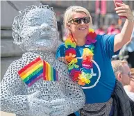  ??  ?? Oor Wullie joined the colourful celebratio­n of LGBT rights in Glasgow yesterday.
More than 7,000 people took part in the Mardi Gla Pride, part of worldwide events marking the 50th anniversar­y of the Stonewall riots.
The rainbow flag adopted by the Pride movement flew above the City Chambers, while marchers also posed with one of Oor Wullie’s Big Bucket Trail sculptures.