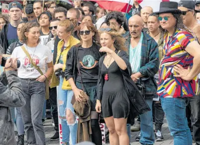  ?? Photo / Mark Mitchell ?? Maria Alyokhina (black dress) exhorted the Government to return the land to mana whenua.