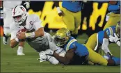  ?? KEITH BIRMINGHAM — THE ORANGE COUNTY REGISTER ?? Stanford quarterbac­k Davis Mills (15) scrambles for a first down against UCLA defensive back Mo Osling III (7) during the first half on Saturday in Pasadena.