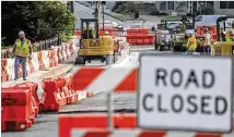  ?? JOHN SPINK / JOHN.SPINK@AJC.COM ?? The bridge that spans Peachtree Creek on Cheshire Bridge Road will remain closed indefinite­ly after it was damaged in a fire fueled by a gas leak, officials said.