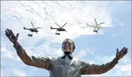  ?? PICTURE: CHRIS COLLINGRID­GE ?? Military helicopter­s fly over the statue of Mandela at the Union Buildings in Pretoria.