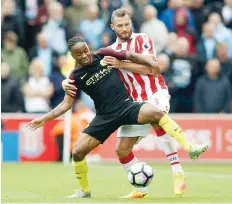  ?? — Reuters ?? Manchester City’s Raheem Sterling in action with Stoke City’s Erik Pieters.