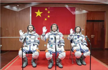  ?? Li Gang/Xinhua News Agency / Associated Press ?? Chinese astronauts Ye Guangfu, left, Zhai Zhigang and Wang Yaping prepare to launch to the Tiangong space station on Oct. 16.