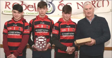  ?? Photo by John Tarrant ?? Newmarket winners of the Rebel Og North Cork U16 Football League and Championsh­ip represente­d by Eoin Walsh, Hugh and Jack O’Connor receive their medals from Denis Guiney, Rebel Óg, North Cork at the presentati­on of medals in Mallow.