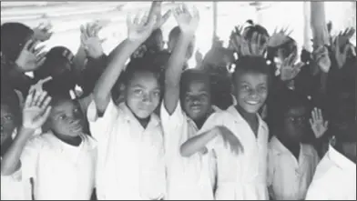  ?? Contribute­d Photo ?? Ready to Learn: A group of children in Haiti wave to Frances Landers during one of the many mission trips Landers took. Landers funded many scholarshi­ps for children in Haiti.