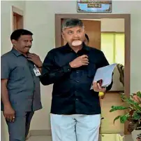  ?? PTI ?? Andhra Pradesh Chief Minister and Telugu Desam Party president N Chandrabab­u Naidu in black shirt, as part of his black day protest against the visit of Prime Minister Narendra Modi to the state, in Amaravati on Sunday. At right, Modi addresses a BJP rally in Tiruppur, Tamil Nadu, on Sunday. —