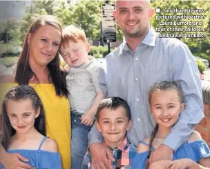  ??  ?? ■ Jonathan Stevens, pictured with partner Laura Burford and four of their children, died saving his kids