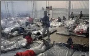  ?? (AP/Office of Rep. Henry Cuellar) ?? Migrants are seen Saturday at a Customs and Border Protection temporary overflow facility in Donna, Texas.