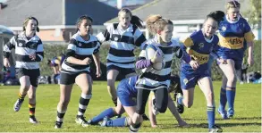  ??  ?? Carving up . . . Southern’s Kyrah Sinclair (10) out on her lonesome heading for the try line against Taieri in the under 10 girls.