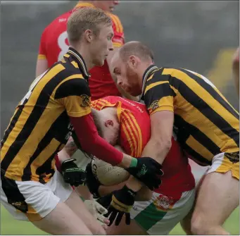  ??  ?? Seán Keane-Carroll and Aidan Cash ensure Dillon Redmond (Starlights) has nowhere to go.