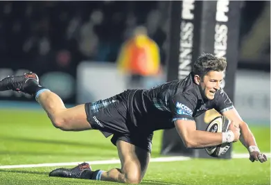  ??  ?? DT van der Merwe dives in for his second try on his first start since returning to Glasgow. Picture: SNS Group.