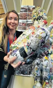  ?? Picture: EUGENE COETZEE ?? WASTE MATTERS: Hollie Matthews, from Canada, shows the novel EcoBrick – a two-litre plastic bottle filled with recyclable waste which is then used for building