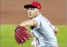  ?? Gene J. Puskar Associated Press ?? THE DEFENDING CHAMPION Dodgers added standout pitcher Trevor Bauer on a three-year contract this month, a luxury few teams could have afforded.