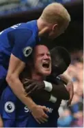  ?? OLI SCARFF/AFP/GETTY IMAGES ?? Wayne Rooney, back at Everton, had reason to shout after scoring the opening goal against Stoke.