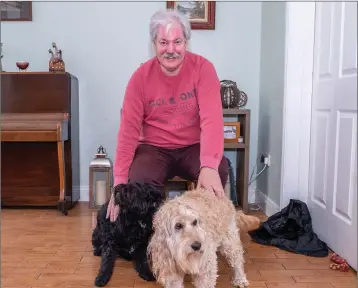  ??  ?? Dominic Leech with his dogs before his fundraisin­g hair and moustache shave last weekend.