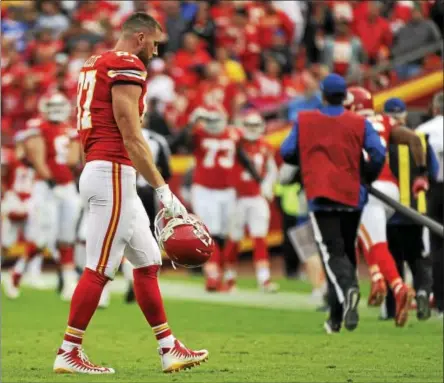  ?? ED ZURGA — THE ASSOCIATED PRESS ?? Kansas City Chiefs tight end Travis Kelce (87) walks off the field Sunday following an NFL football game against the Buffalo Bills in Kansas City, Mo. The Buffalo Bills won 16-10.