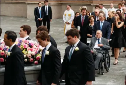  ?? The Associated Press ?? HOUSTON: Former President George W. Bush and his father, former President George H.W. Bush, watch as the casket of former first lady Barbara Bush is loaded into a hearse at St. Martin’s Episcopal church on Saturday in Houston.