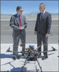  ?? Bill Dentzer Las Vegas Review-Journal ?? Polish President Andrzej Duda, right, and Chris Walach of the Nevada Institute for Autonomous Systems look over a drone Saturday at the Reno-Stead Airport.