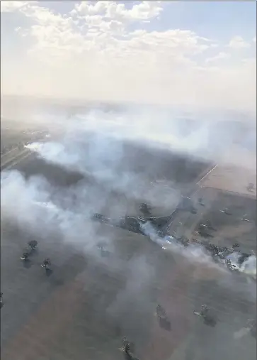  ??  ?? Region blanketed . . . An aerial view of the fires near Berrigan.