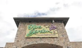  ?? ELISE AMENDOLA/AP ?? Olive Garden’s parent company will spend $17 million on one-time bonuses for its nearly 90,000 hourly employees.