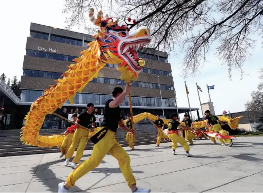  ?? CITIZEN PHOTO BY BRENT BRAATEN ?? A Dragon Dance was performed on the steps of city hall on Monday to help promote a Canada Day Drumming Celebratio­n.
