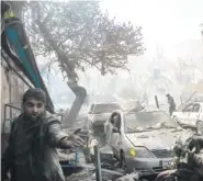  ?? NEW YORK TIMES NEWS SERVICE ?? A shopkeeper surveys the destructio­n in the immediate vicinity of a bombing Saturday in Kabul, Afghanista­n.