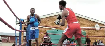  ?? Picture: TEMBILE SGQOLANA ?? LOOKING: Alwam Tom, from Ilinge Boxing Club, prepares to strike Aviwe Martini from QBBC in their bout on Saturday.