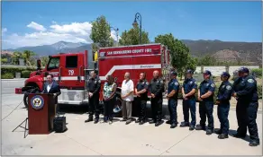  ?? ?? Firefighte­rs look on during a news conference as local leaders discuss the Wildfire Response and Drought Resiliency Act. The act, a package of 49bills introduced by the House Committee of Natural Resources, passed in the House on Friday and heads to the Senate.