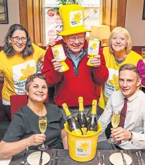  ??  ?? Martine Sinclair and Lee Deans, front, with, back from left, Alyson Johnston, Philip Gill and Marion Thomson from Marie Curie.