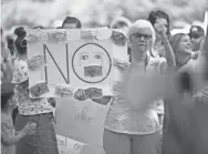  ?? CHRIS CALDWELL/USA TODAY NETWORK ?? Members of the community gather at the Washington County School District office to protest the use of masks in local schools Aug. 21.