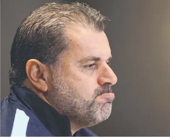  ?? Picture: GETTY IMAGES ?? A defiant Socceroos coach Ange Postecoglo­u speaking to the media yesterday.