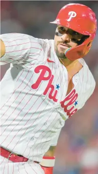  ?? MATT SLOCUM/AP ?? The Phillies’ Nick Castellano­s celebrates after hitting a home run in the eighth inning of Game 3 of the NLDS Wednesday night.