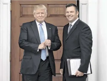  ?? SIPA USA TNS ?? President Donald Trump, left, and Kris Kobach, the Kansas secretary of state, on Nov. 20, 2016, at the clubhouse of Trump Internatio­nal Golf Club, in Bedminster Township, N.J.