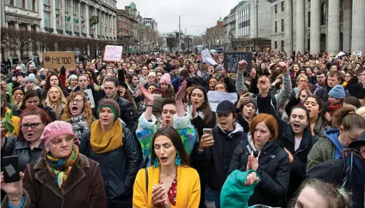  ??  ?? Outraged: More than a thousand protesters chanted ‘I stand with her’ as they filled the streets of Dublin yesterday