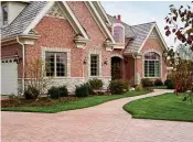  ?? Submitted photo ?? ■ Upgrading a driveway and walkway is one way to update a home’s exterior and restore its curb appeal.