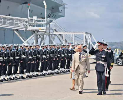  ?? ?? The Duke and Duchess of Cornwall on HMS Queen Elizabeth, in Portsmouth, yesterday