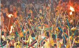  ?? — DC ?? Groups of villagers clash with sticks for the idols belonging to a temple as part of the annual Banni festival in Kurnool district.